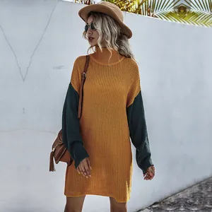 Detail of high neck knitted dress showing two-tone mustard yellow and dark green stitching