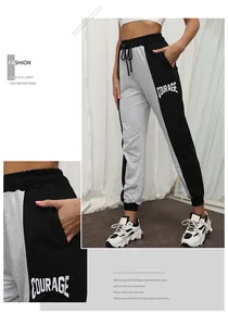 Detail of color-block joggers featuring Courage letter print and drawstring waist
