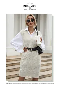 Macro detail of cream cable knit texture and v-neck design with stylish wide belt