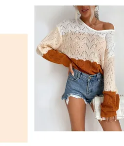 Detail of V-neck hollow knit sweater with tricolor patchwork and wavy crochet texture