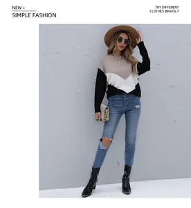 Detail of color-block knit sweater with khaki, white, and black V-shaped pattern