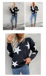 Detail of loose fit knit sweater with white star jacquard pattern and drop shoulders