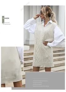Detail of cable-knit vest dress in cream with v-neck and textured fabric close-up