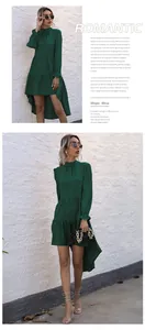 Detail of dark green asymmetrical tiered dress with ruffled hem and long sleeves