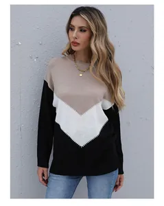 Close-up of three-color block knit sweater featuring khaki white and black V-pattern