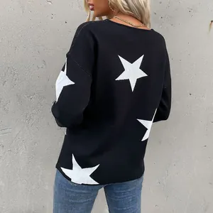 Women's black knit sweater with large white star jacquard pattern and long sleeves