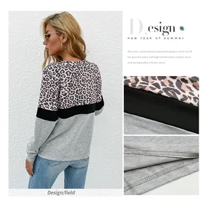 Detail of color-block long sleeve shirt with leopard print and neat flatlock stitching