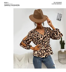 Detail of hollow-out sleeves and leopard print texture on a V-neck waist-tie blouse
