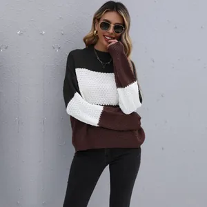 Women's color block knit sweater in black, white and brown with textured cable knit sleeves