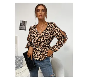 Detail of leopard print blouse showing V-neckline and slit lantern sleeves on a model