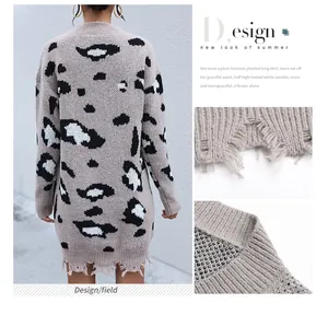 Detail of distressed hem with torn holes on oversized leopard print knit sweater dress
