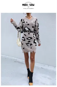 Close-up of V-neck leopard print knit dress with unique fringe distressed hem details