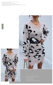 Detail of V-neck leopard print knit dress with frayed hem and distressed tassel edge
