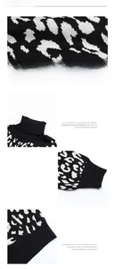 Détail du pull en tricot à imprimé léopard noir et blanc avec col roulé et finitions