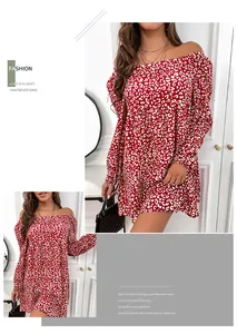 Detail of red and white floral print on an off-the-shoulder mini dress with long sleeves