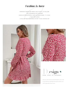 Detailed view of red floral dress featuring tiered ruffle hem and waist tie closure