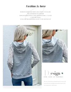 Détail des manches en dentelle crochetée blanche et du tissu gris d'un sweat à capuche