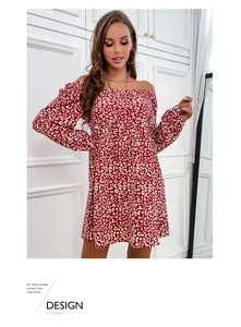 Close-up of red and white leopard print dress with off-shoulder neckline and long sleeves