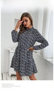 Detail of ruffled high collar and hollow cut-out on navy floral long sleeve dress