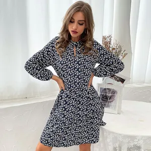 Vintage floral long sleeve navy blue dress with cutout neckline and button details