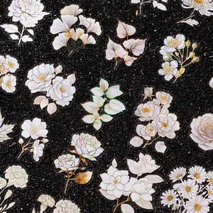 Assorted floral laser stickers with shimmering holographic outlines for journals