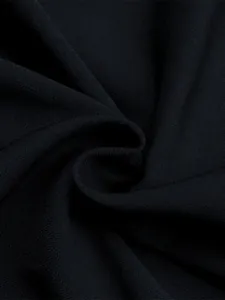 Detailed macro view showing the fine grain texture and drape of black chiffon fabric