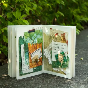 Nature-themed spiral notebook featuring vintage leaf textures and collage art elements