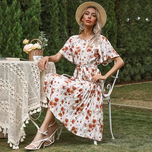 Floral pleated summer midi dress with ruffle sleeves and waist tie in cream and orange
