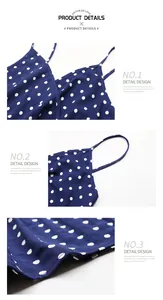 Detailed close-up of navy blue polka dot chiffon fabric, thin straps, and V-neckline