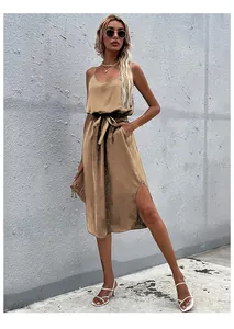 Detail view of khaki satin midi dress with waist tie and elegant side slit design