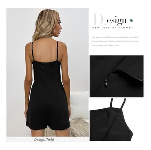 Detail view of back invisible zipper and shoulder strap stitching on black summer romper