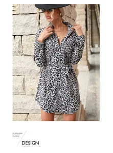 Detail of leopard print shirt dress featuring a lapel collar and matching waist belt