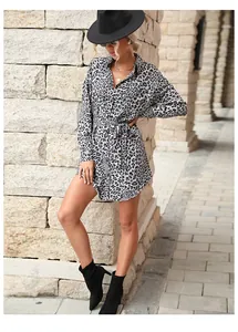 Detail of waist-tie design on leopard print shirt dress with button closure