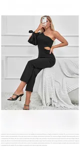 Detail of black one-shoulder jumpsuit with bow tie sleeve and waist cutout detail