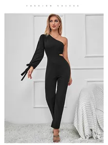 Close-up of black one-shoulder jumpsuit featuring a cut-out waist and long sleeve detail