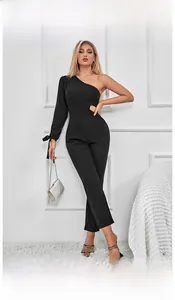 Detail of black one-shoulder jumpsuit with waist cutout and bow tie cuff decoration