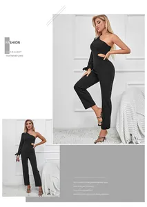 Detail of one-shoulder jumpsuit featuring waist cutout and lace-up sleeve design