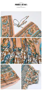 Dettagli dell'abito boho con scollo a V, vita elastica e motivi floreali stampati