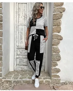 Detail of two-piece casual set featuring color-block patchwork and waist drawstring