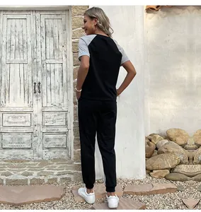 Back view of women's two-piece casual set featuring a black and grey patchwork short-sleeve tee