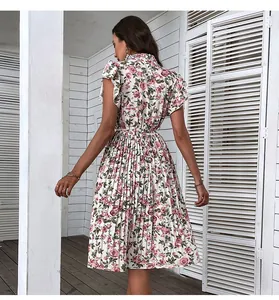 Back view of a summer pleated floral dress with pink rose prints and butterfly sleeves