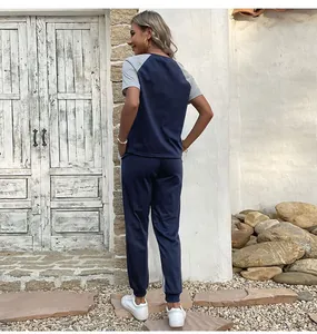 Rear view of women's navy blue and grey patchwork casual two-piece tracksuit set