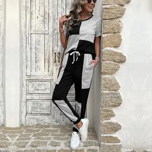 Women's two-piece casual set featuring grey and black patchwork shirt and joggers