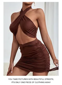 Detailed close-up of brown halter crop top and ruched mini skirt with side drawstrings