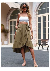 Macro shot of army green high-low wrap skirt with ruffle hem and waist tie detail