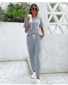 Detail of gray casual short sleeve hoodie and matching joggers set with white drawstrings