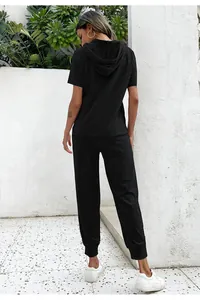 Rear view of casual black two-piece lounge set with short sleeve hoodie and joggers