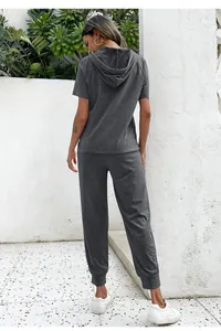 Back view of a dark gray short sleeve hoodie and jogger pants two-piece lounge set