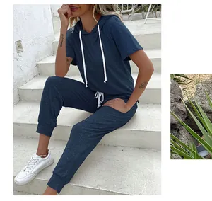 Detail of dark blue women's two-piece lounge set with hooded short sleeve top and joggers