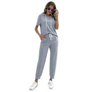 Women's grey casual two-piece set with hooded short sleeve top and drawstring joggers